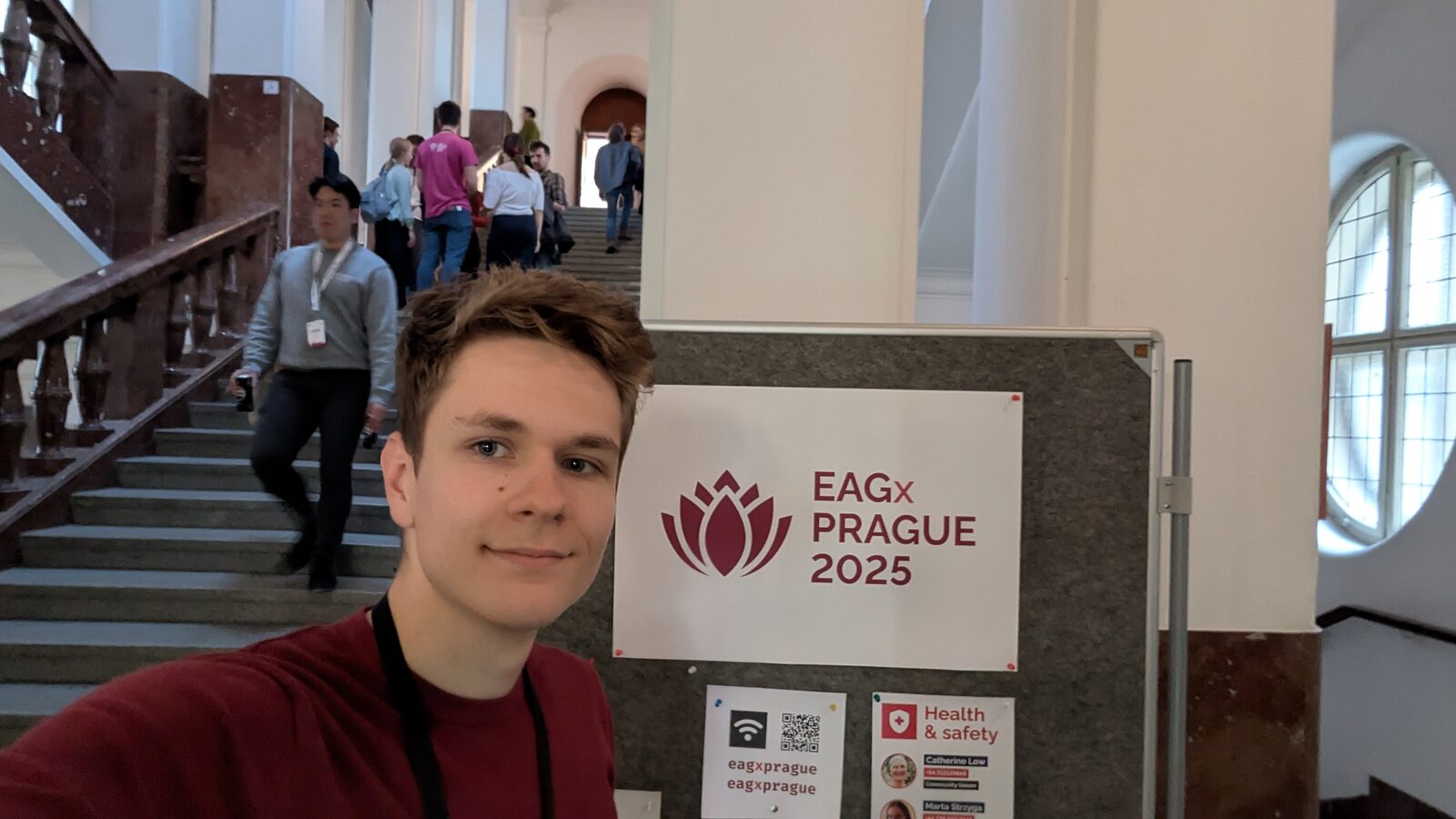 Standing next to the EAGx Prague 2025 sign